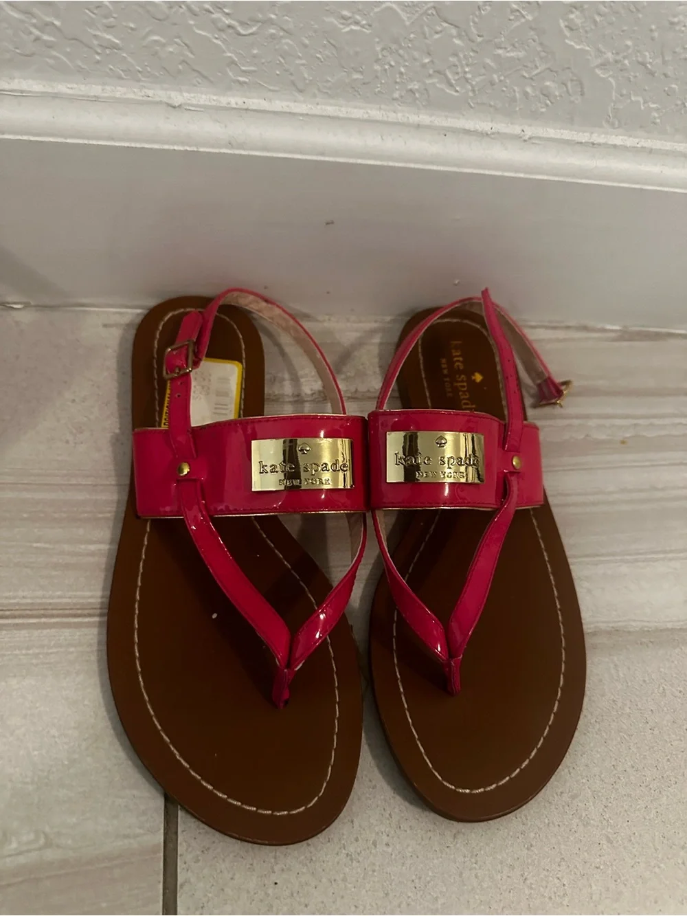kate spade Hot Pink Patent Thong Sandals with Gold Logo Plate